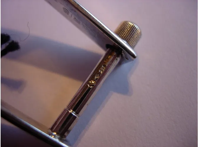 Llavero Yves Saint Laurent en plata de ley. 925 
