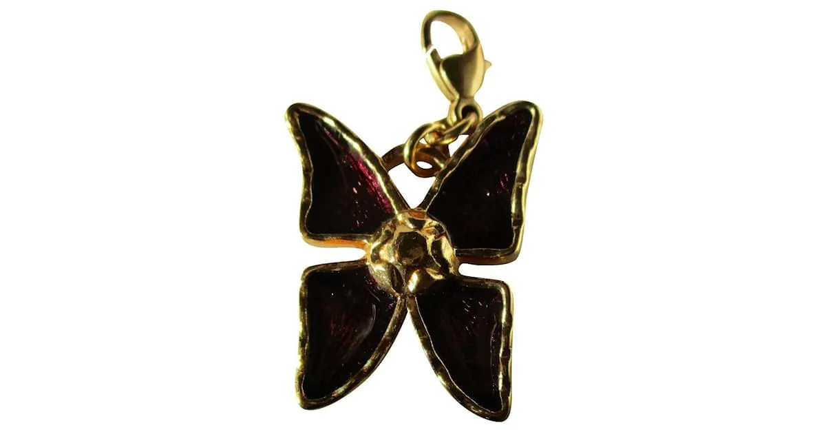 Yves Saint Laurent encantos de mariposa. Dorado 