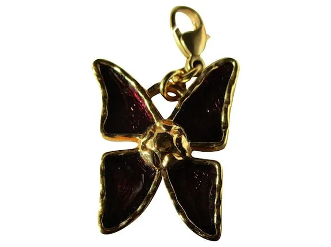 Yves Saint Laurent encantos de mariposa. Dorado 
