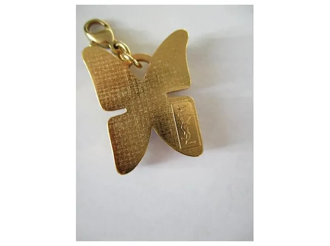 Yves Saint Laurent encantos de mariposa. Dorado 