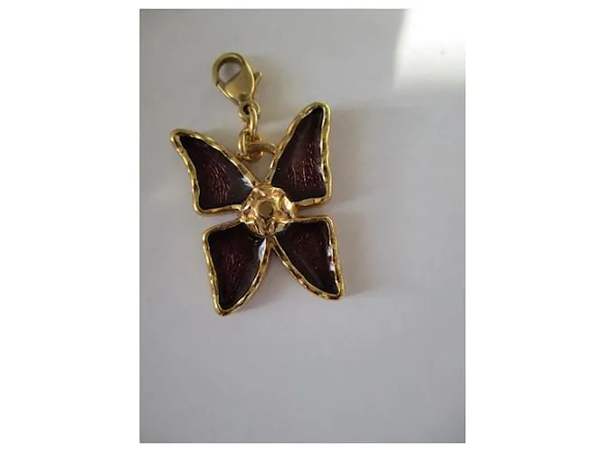 Yves Saint Laurent encantos de mariposa. Dorado 